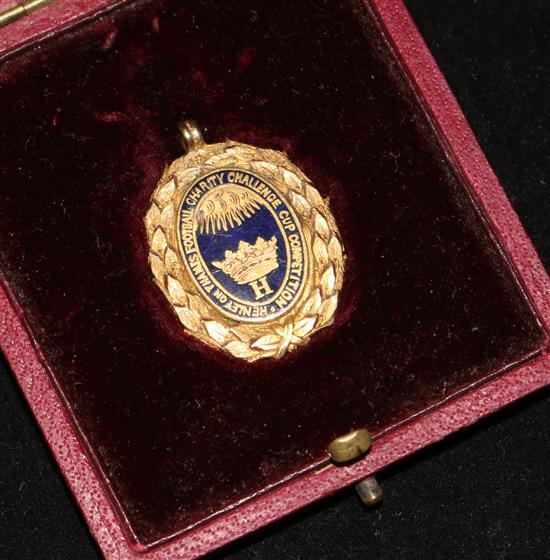 A cased late Victorian 9ct gold football medal, 1.25in.